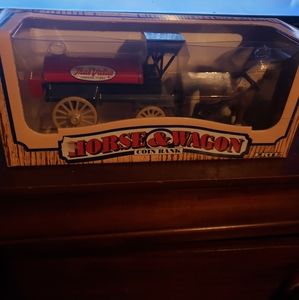 Horse and wangon coin bank with key.